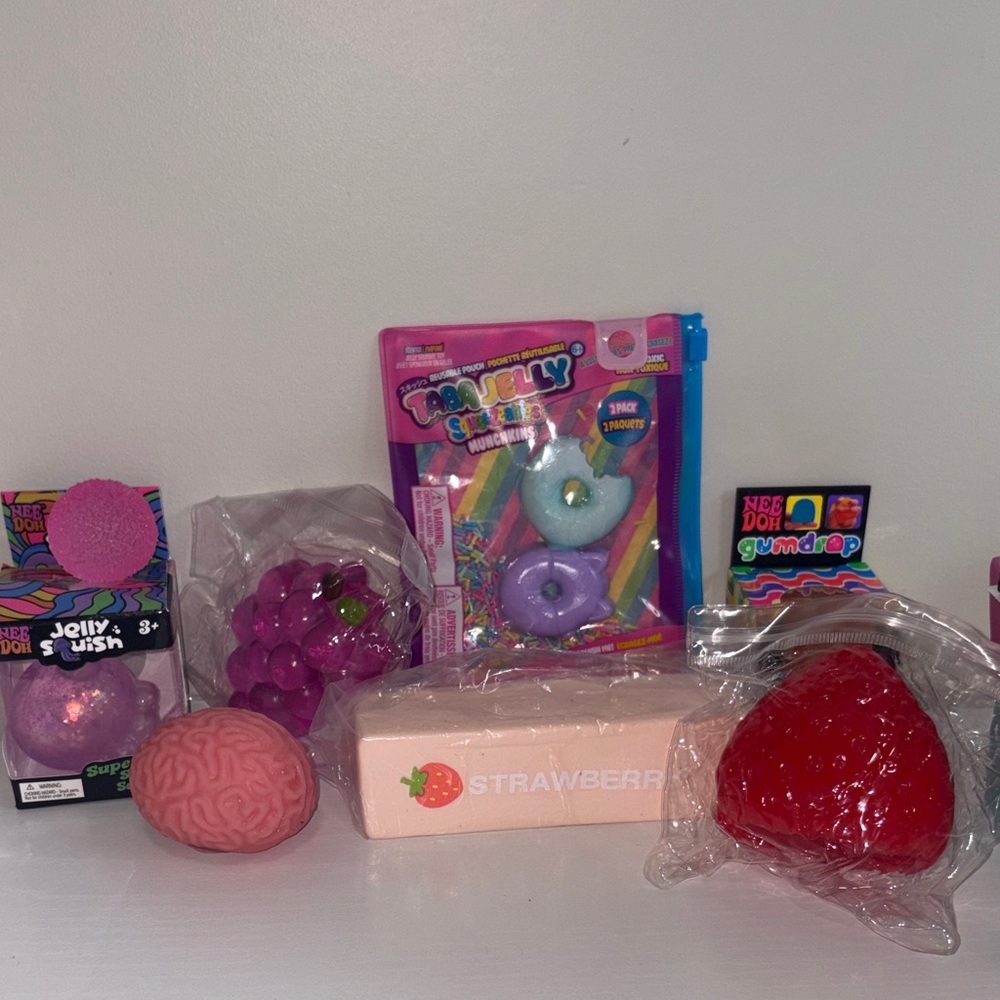 NeeDoh gumdrop, strawberry & other squishys. Viral ones.